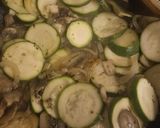 A picture of step 2 of Salmon fillets with courgettes onion and mushrooms.