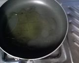 A picture of step 5 of Homemade crispy Patra with some spicy green chutney.