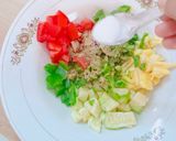 A picture of step 3 of Ajwain leaf salad with veggies and pineapple.