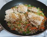 A picture of step 6 of Maggi stuffed jacket potatoes.