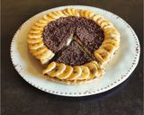 Foto del passaggio 15 della ricetta Crostata con frolla di banane e crema nocciolata