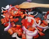 A picture of step 1 of Spicy chicken, veg and black rice one pan.