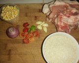 Foto del paso 1 de la receta: Arroz con chuleta de cerdo y maíz tierno