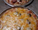 A picture of step 5 of A Real Meat-lovers Pizza and Cheesy Pizza.