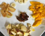 A picture of step 1 of Mango Apple Chikoo Banana & Date Smoothie.