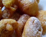 A picture of step 3 of Sweet Banana fritters with dusting of icing sugar n cinnamon.