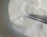 A picture of step 1 of Mango flavoured milk cake in two layers.