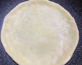 A picture of step 1 of Thin crust chicken shrimp pizza (stovetop).