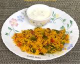 A picture of step 13 of Capsicum Tomato Rice.