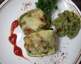 A picture of step 8 of Zucchini stuffed with cheesy Guacamole.