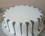 A picture of step 11 of Icing the cake n trying out on chocolate drips#authormarathon.