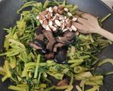 A picture of step 3 of Calzones with Wild Dandelion Greens, Black Olives, and Almonds.
