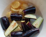 A picture of step 1 of Brinjal potato curry in pressure cooker.