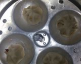 A picture of step 4 of Rice modak.