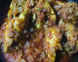 A picture of step 11 of Chicken Tangdi Masala.