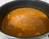 A picture of step 8 of Chana Paneer with Kasoori methi flavoured Bhaturas.