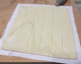 A picture of step 1 of Eggs And Coconut On SunDried Pesto Top Parmesan Puff Pizza.