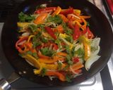 A picture of step 2 of Colorful Fry Pan Peppers and Onions.