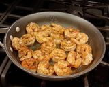 A picture of step 11 of Crab and Shrimp Enchiladas with Hatch Chili Sauce.