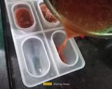 A picture of step 2 of Watermelon Ice Popsicles.