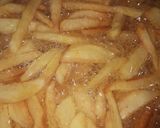 A picture of step 4 of Kibda (Egyptian liver sauce) and French fries.