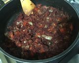 Une image de l'étape 12 de Dahl de lentilles jaunes aux carottes violettes, tomates et courgette.