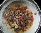 A picture of step 7 of "Eggless Fruits and nuts pineapple muffins".