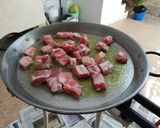 A picture of step 1 of Pork Rib and Cauliflower Paella.