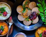 A picture of step 13 of Multigrain Idli, Garlic Chutney, Coconut Chutney, Sambhar.