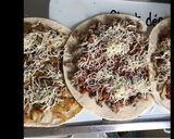 Une image de l'étape 3 de Italian flatbread farci en roulé au veau oignons caramélisés champignons fromage et épices.