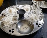 A picture of step 4 of Thengai Paal Idiyappam(Rice noodels with Jaggery,coconut syrup.