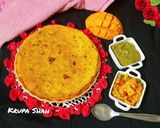 A picture of step 7 of Mango theplas with mango salsa.