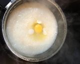 A picture of step 8 of Let's bond over cucumber salad and egg congee.