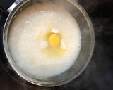 A picture of step 8 of Let's bond over cucumber salad and egg congee.