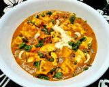 A picture of step 4 of Paneer Butter Masala with fresh cream.