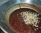 A picture of step 21 of Dodha Burfi with Daliya.
