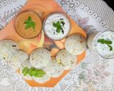 A picture of step 4 of Veggie Idlis with coconut and red chutney.