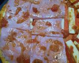 Foto del paso 3 de la receta: Pizza mita - mita (con 5 ingredientes básicos)