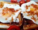 A picture of step 2 of My Simple Fried Egg on Toast with Bacon Crisps and Tomatoes. 😘.