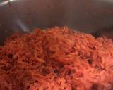 A picture of step 1 of Gajar ka halwa (colourful dish).