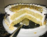 A picture of step 8 of Coconut cake with whipped cream frosting 🤤🤤🤤.