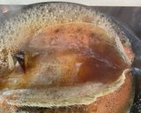 A picture of step 3 of Japanese style boiled plaice.