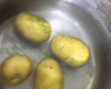 A picture of step 1 of Aloo ka bhurta.