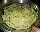 A picture of step 3 of Frozen masala fries.
