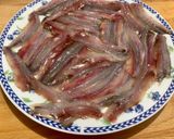 A picture of step 5 of Microwave Marinated Anchovies with Olive Oil, Lemon, Salt, and Pepper.