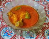 A picture of step 10 of Achari chicken.