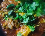 A picture of step 12 of Chicken Tangdi Masala.