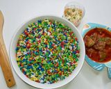 A picture of step 3 of Dammies coloured rice served with meat balls in sauce & coleslaw.