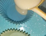 A picture of step 3 of Vanilla cup cake with butter cream frosting 😊.