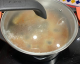 Foto del paso 3 de la receta: Arroz con calamares en su tinta de lata